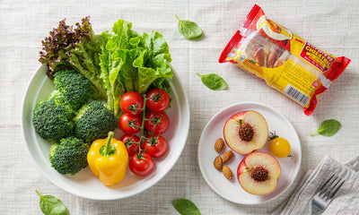 Fresh vegetables beside a packaged snack, overhead flat lay