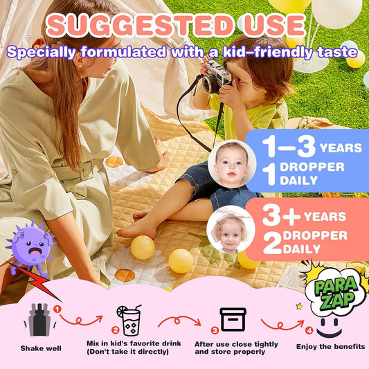 Kids mixed berry digestive drops dropper beside a small glass of water at a table